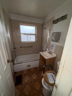 a bathroom with a sink toilet and mirror