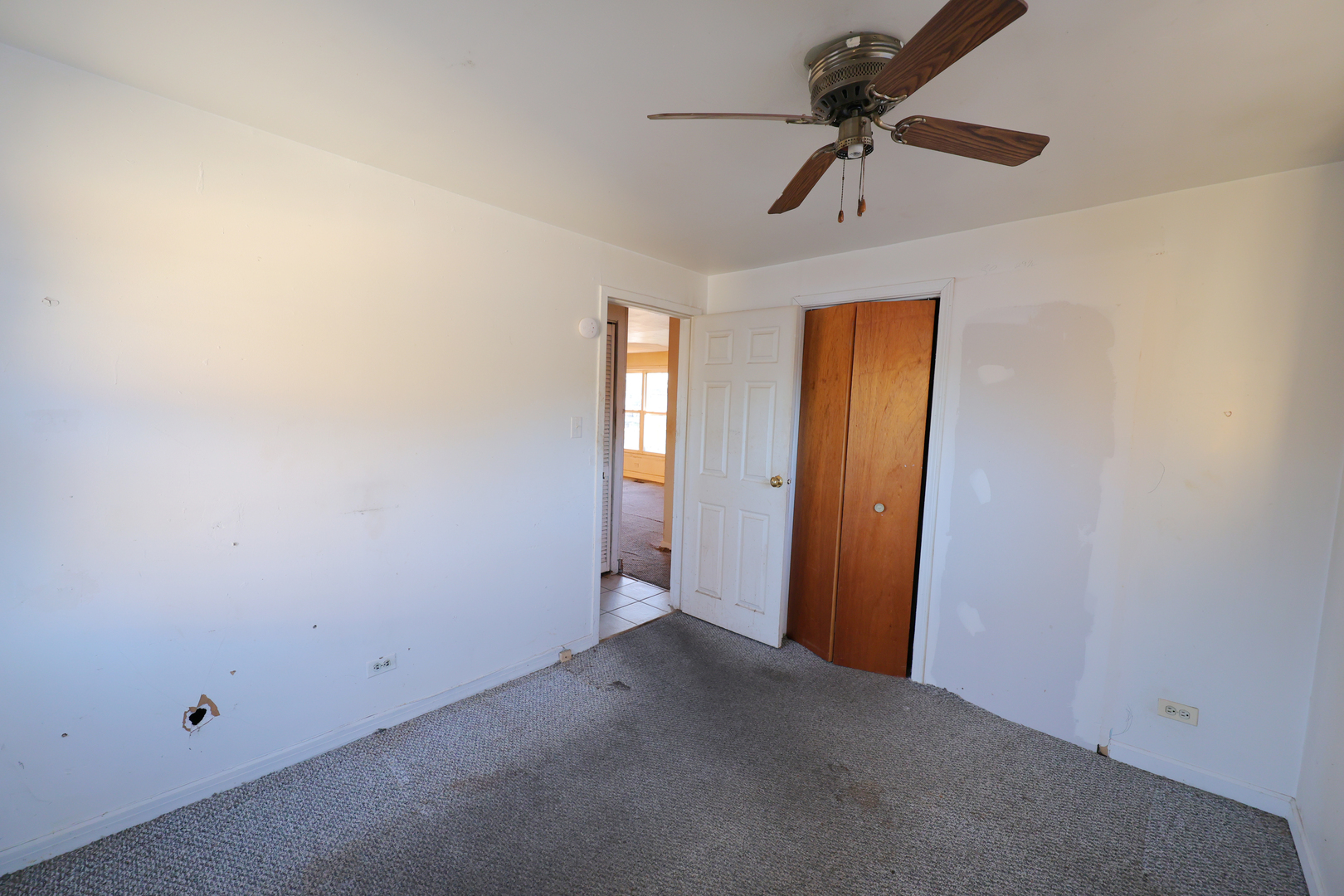3210 Mc Breen Avenue Robbins, IL 60472 - Photo 16 of 21 an empty room with windows and fan