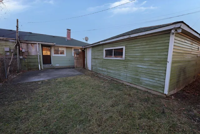 a view of a backyard of the house