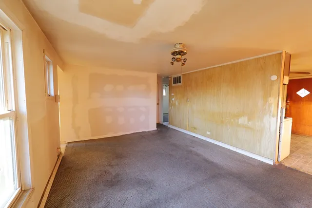 a view of a room with a glass door