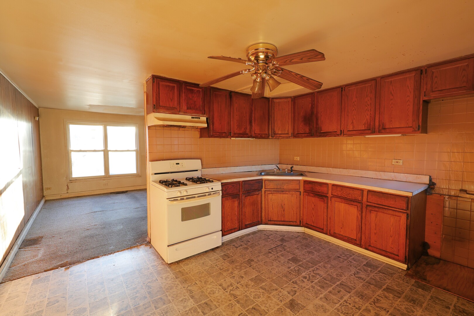 3210 Mc Breen Avenue Robbins, IL 60472 - Photo 7 of 21 a kitchen with stainless steel appliances granite countertop a stove a sink and a refrigerator