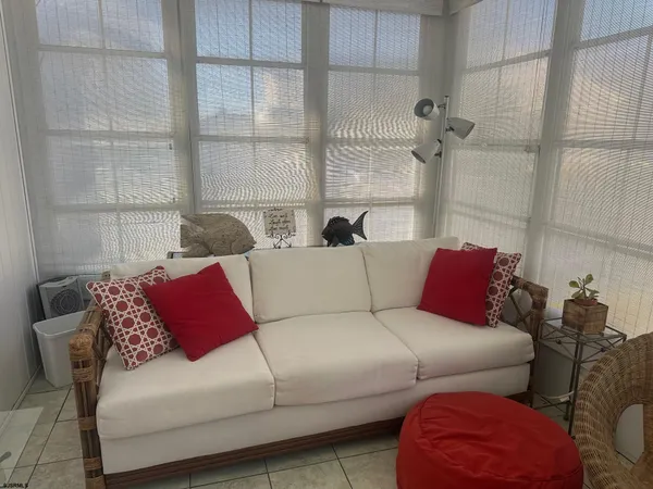 a living room with furniture and a window