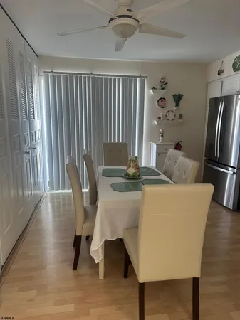 a dining room with furniture and a rug