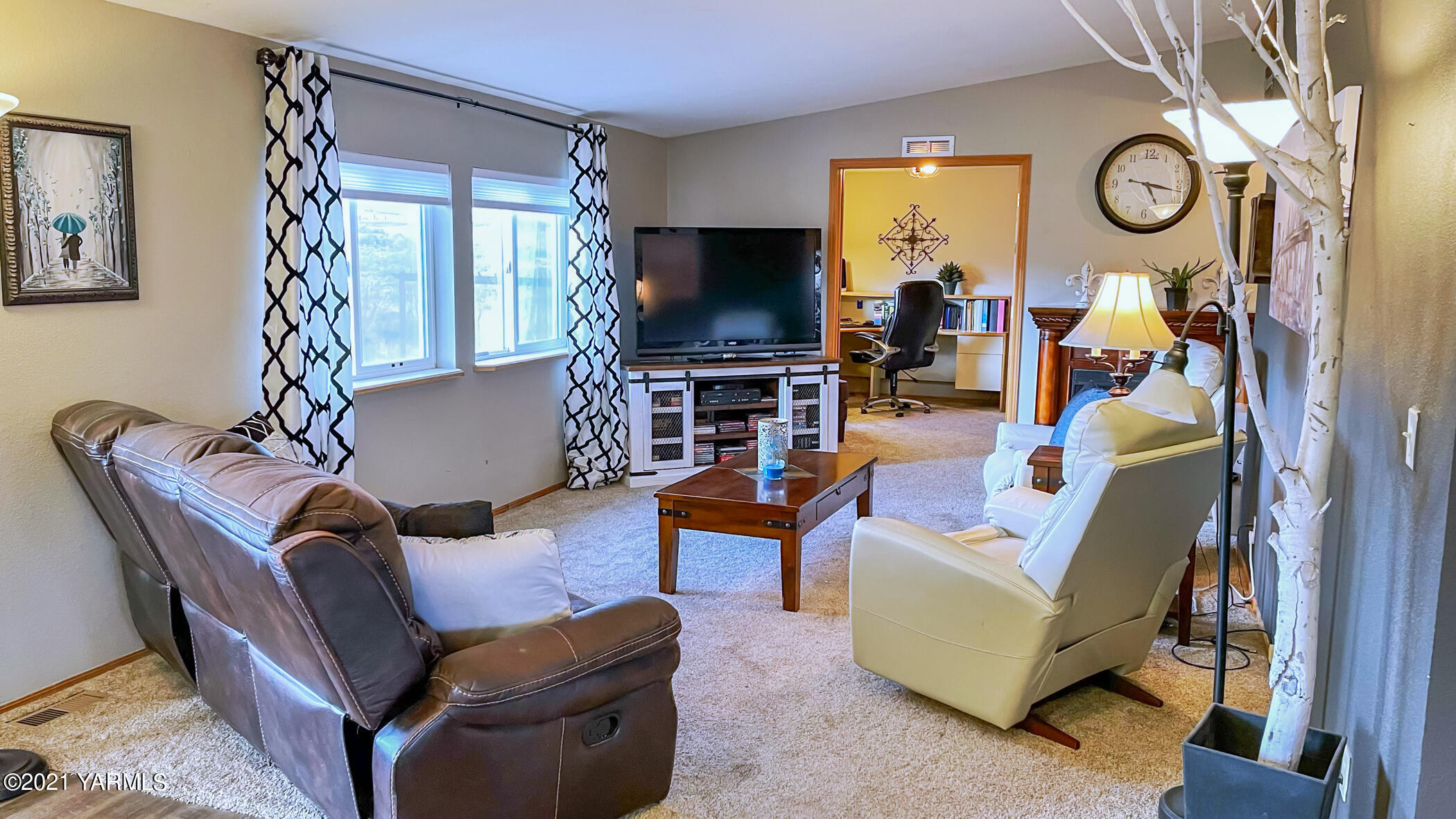 661 Wakatak Road Yakima, WA 98908 - Photo 11 of 20 a living room with furniture and a flat screen tv