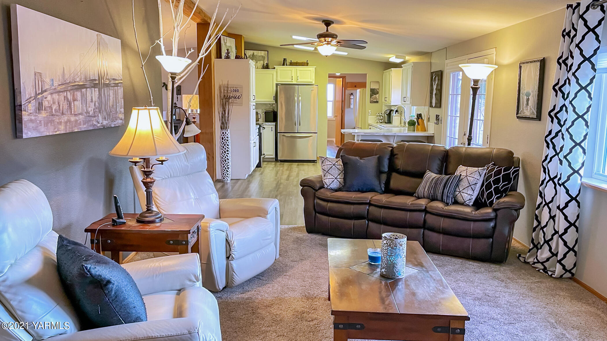 661 Wakatak Road Yakima, WA 98908 - Photo 12 of 20 a living room with furniture and a chandelier
