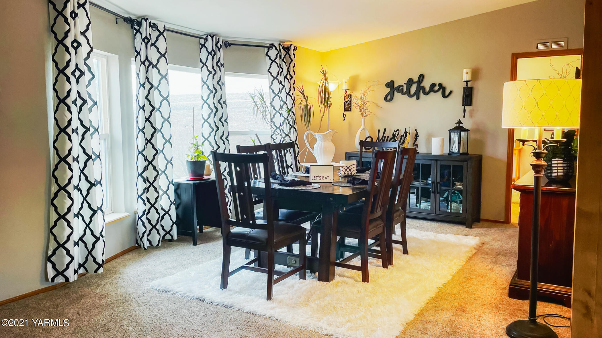 661 Wakatak Road Yakima, WA 98908 - Photo 3 of 20 a dining room with furniture and a floor to ceiling window
