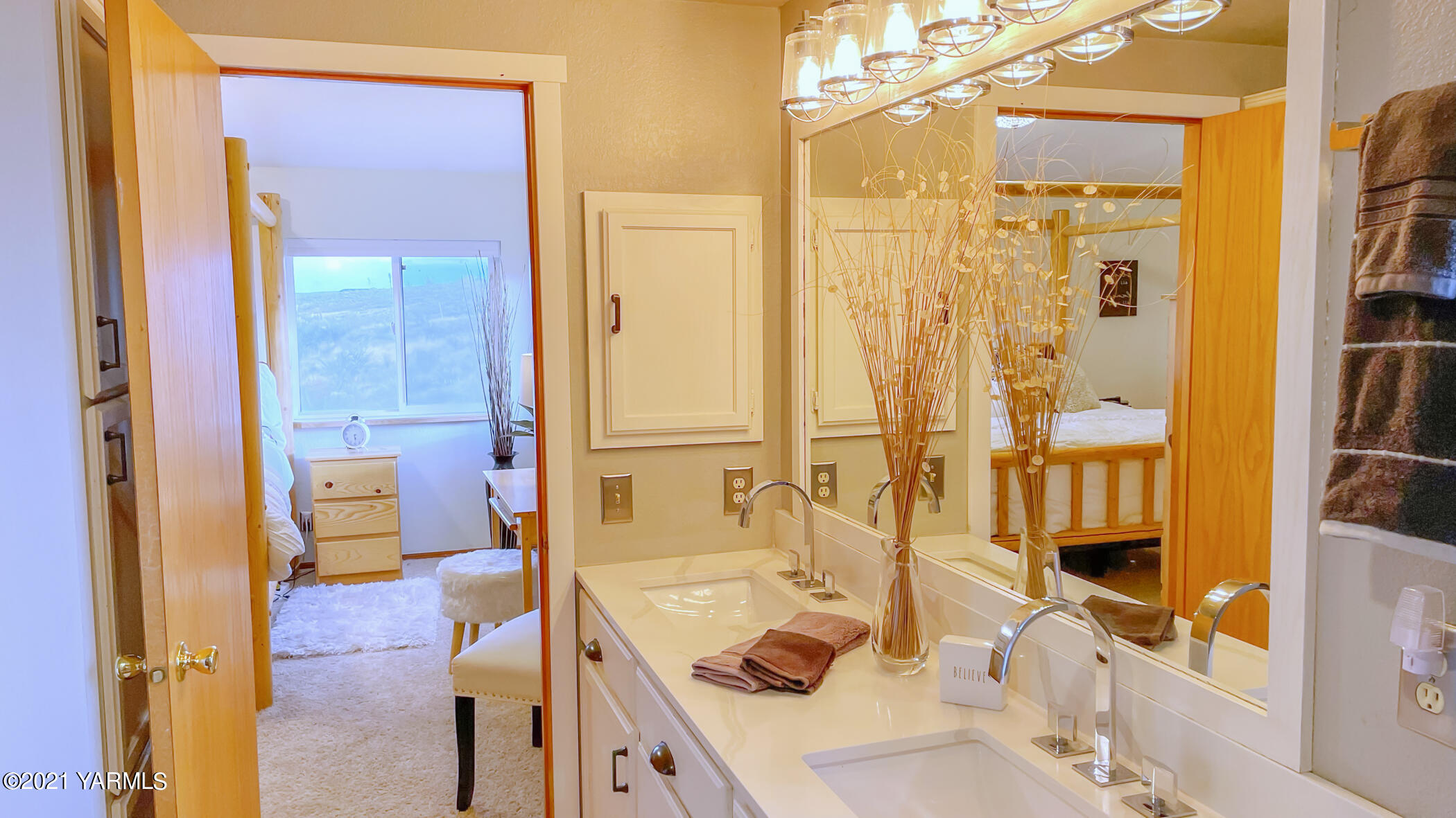 661 Wakatak Road Yakima, WA 98908 - Photo 9 of 20 a bathroom with a tub sink and mirror
