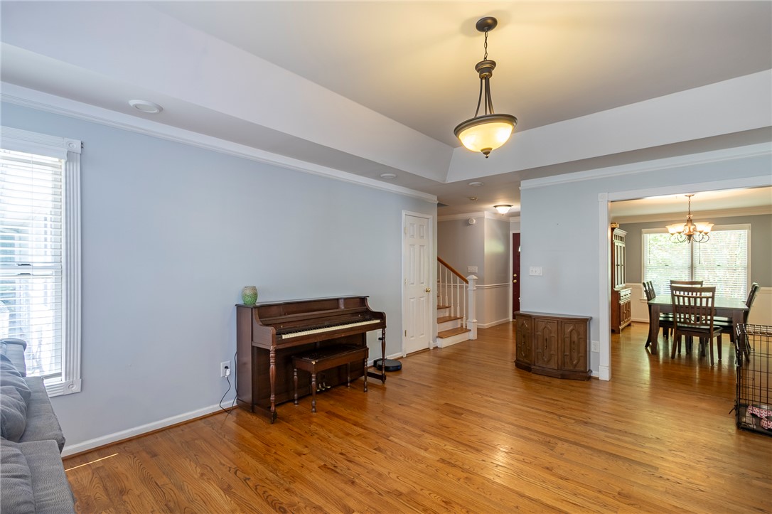 151 Hannah Circle Anderson, SC 29621 - Photo 9 of 46 This inviting interior features gleaming hardwood floors and elegant crown molding, creating a warm and refined atmosphere.