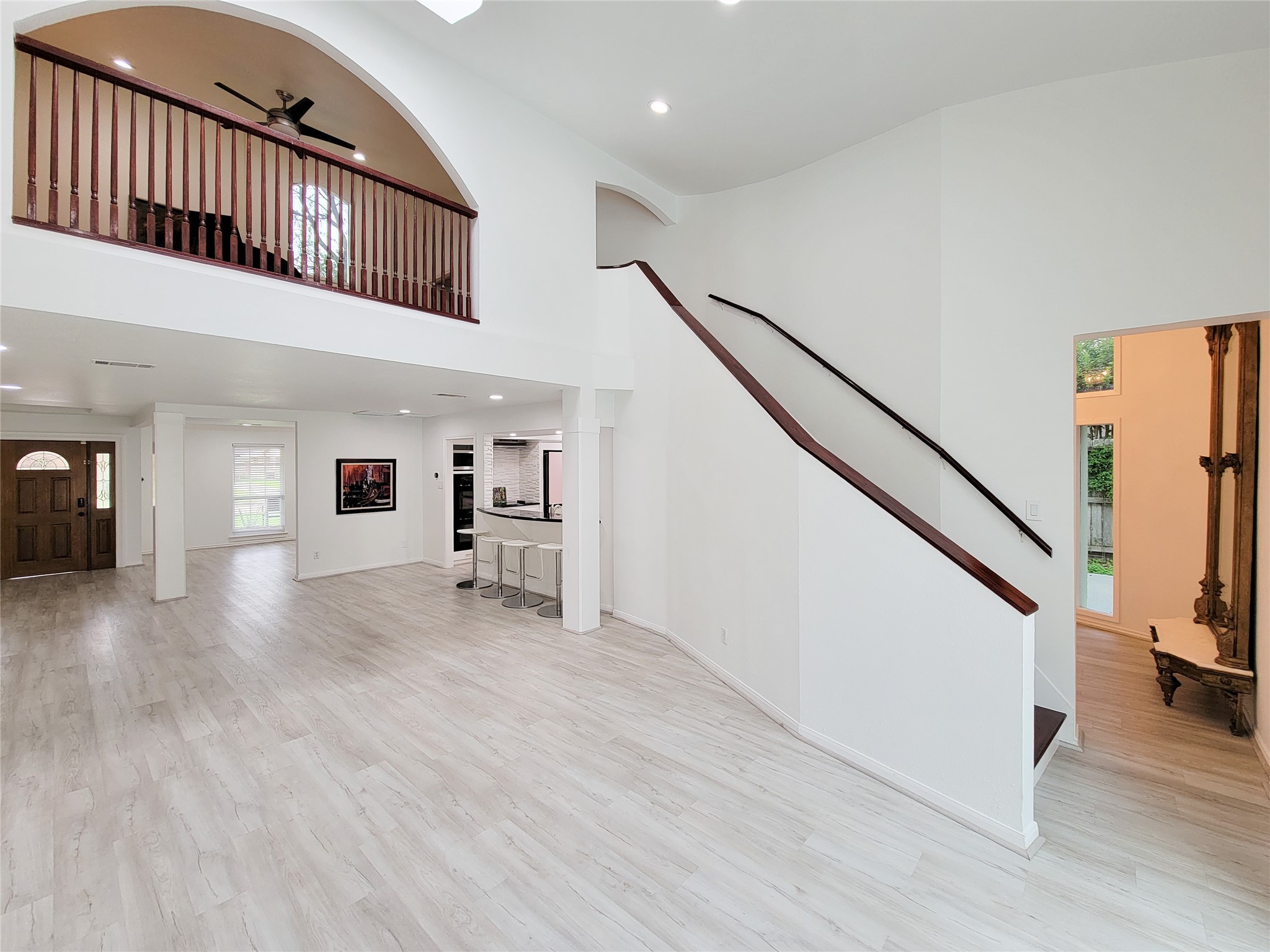 5654 Cheena Drive Houston, TX 77096 - Photo 50 of 50 a view of a hallway with wooden floor and stairs
