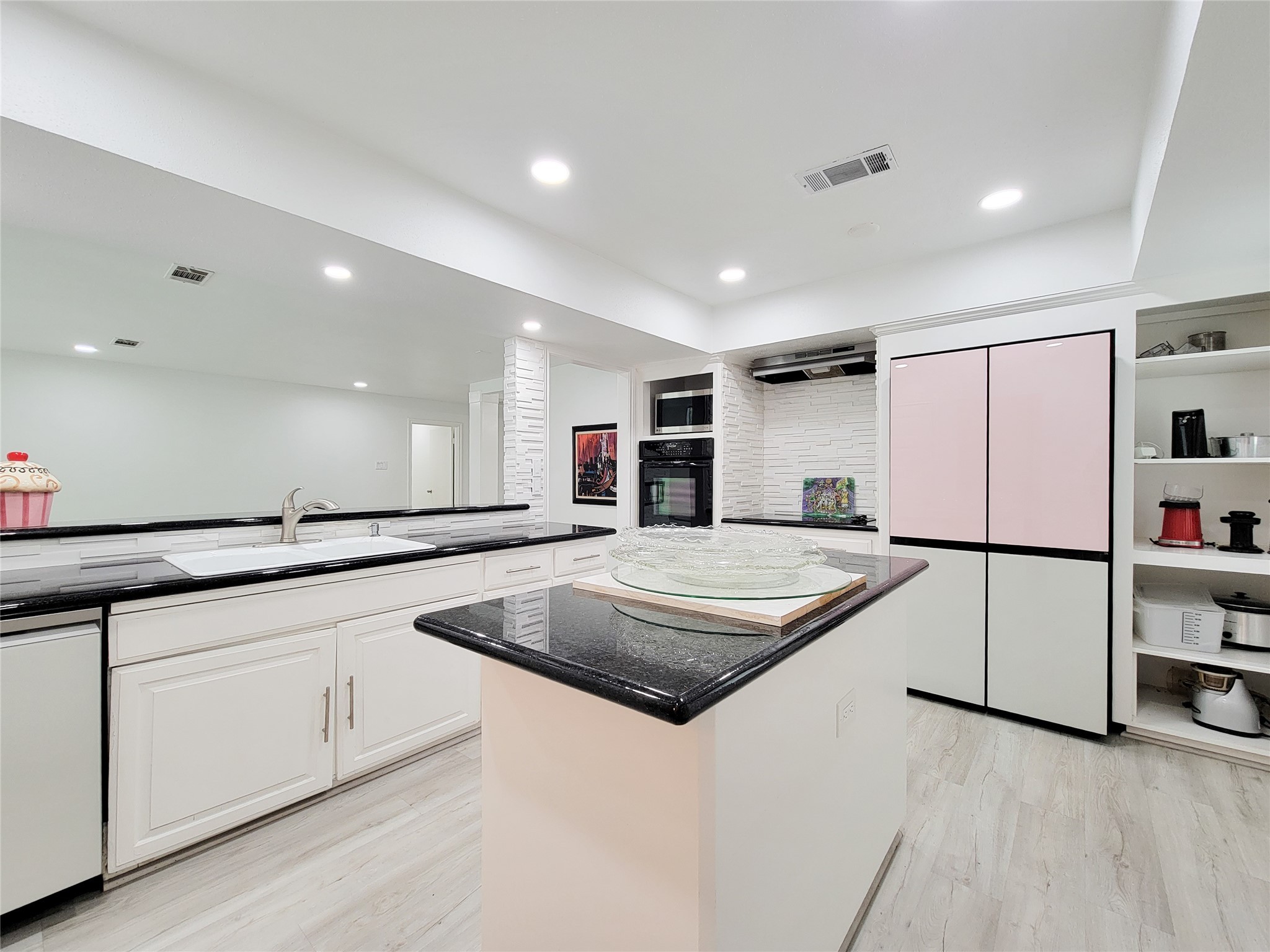 5654 Cheena Drive Houston, TX 77096 - Photo 11 of 50 a kitchen with stainless steel appliances granite countertop a sink and a refrigerator