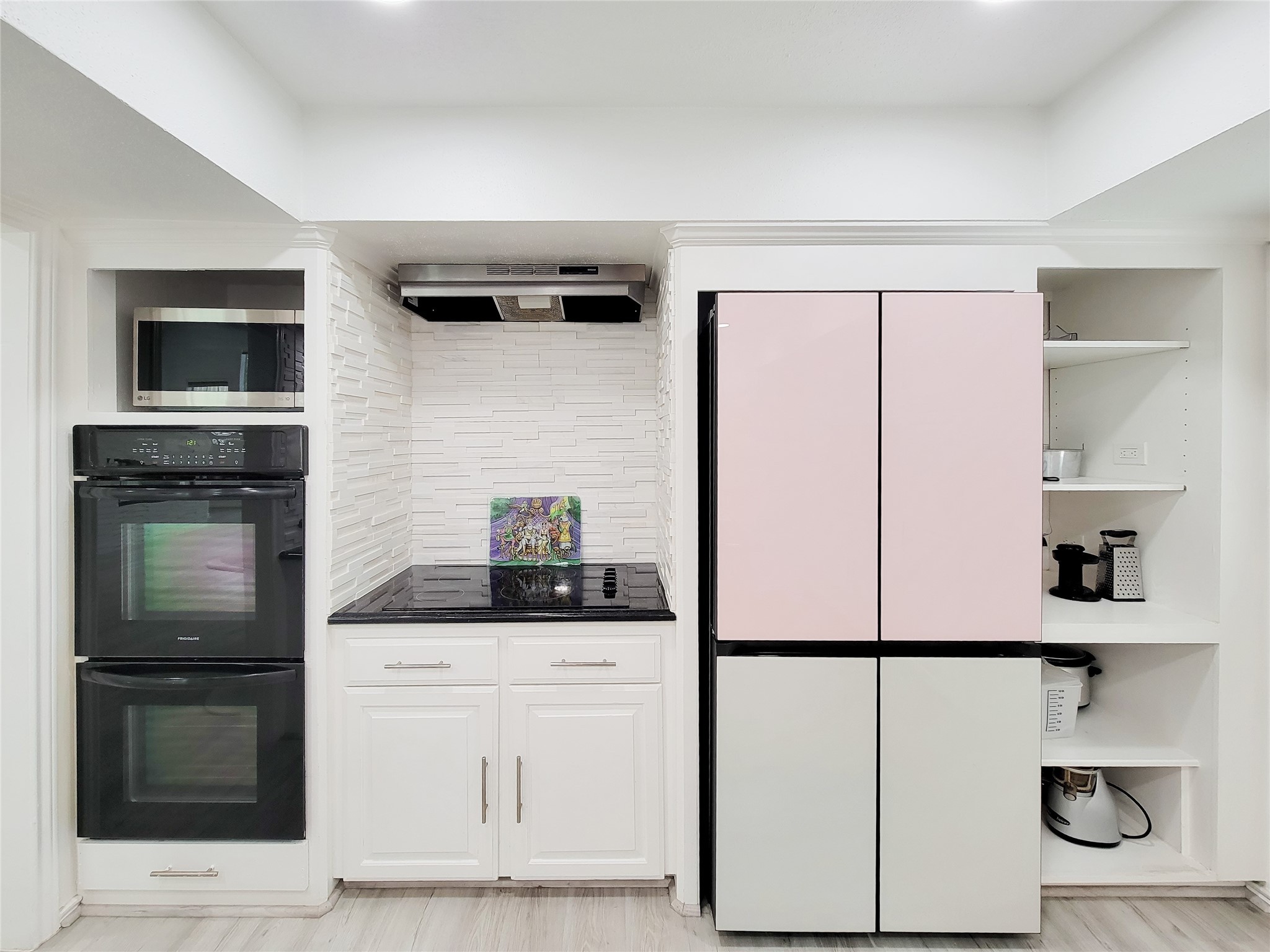 5654 Cheena Drive Houston, TX 77096 - Photo 15 of 50 a kitchen with white cabinets and refrigerator