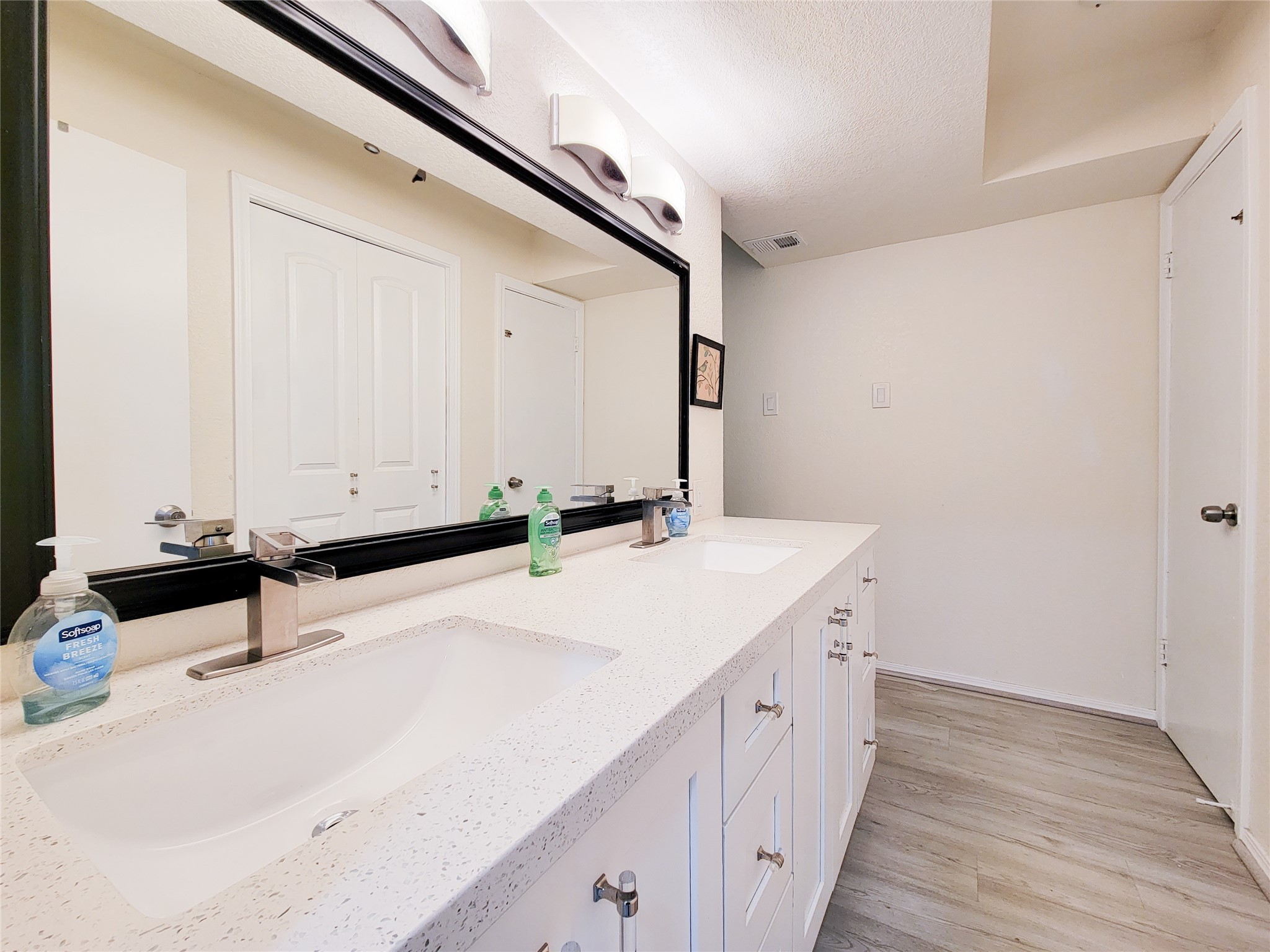 5654 Cheena Drive Houston, TX 77096 - Photo 24 of 50 a bathroom with a sink and a mirror