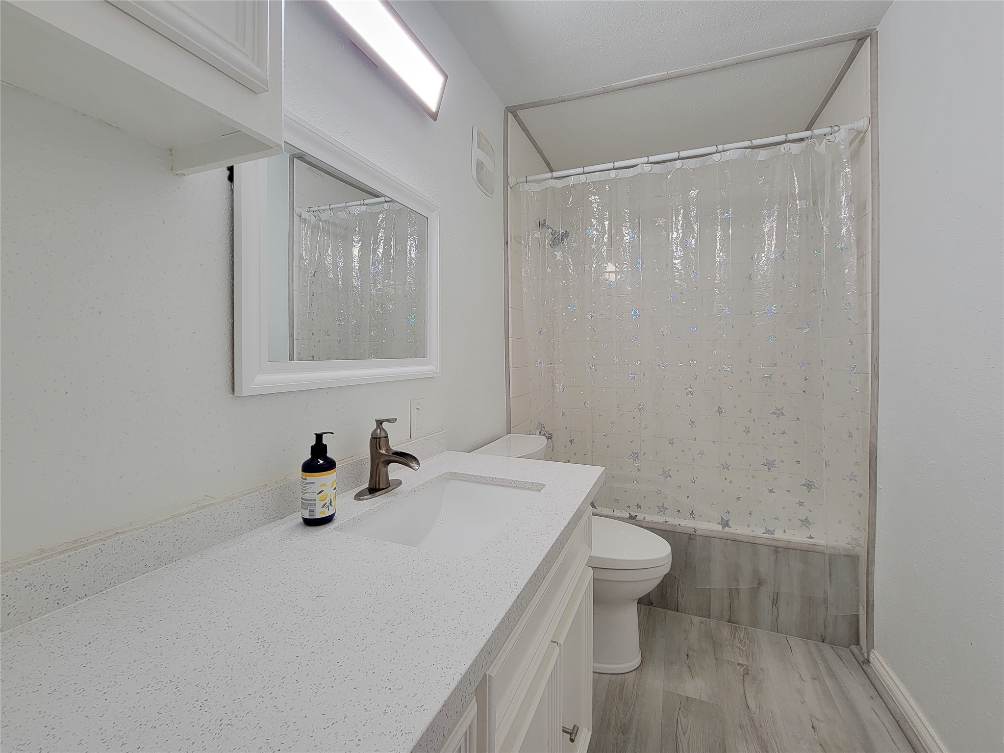 5654 Cheena Drive Houston, TX 77096 - Photo 27 of 50 a bathroom with a sink a toilet and shower