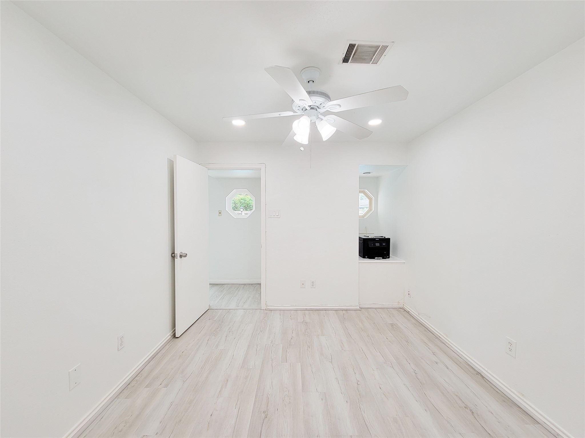 5654 Cheena Drive Houston, TX 77096 - Photo 28 of 50 an empty room with a empty space and a ceiling fan