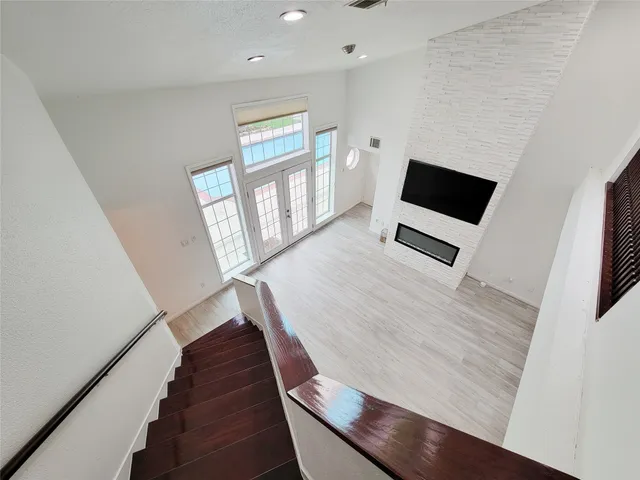 an empty room with a empty space and a ceiling fan