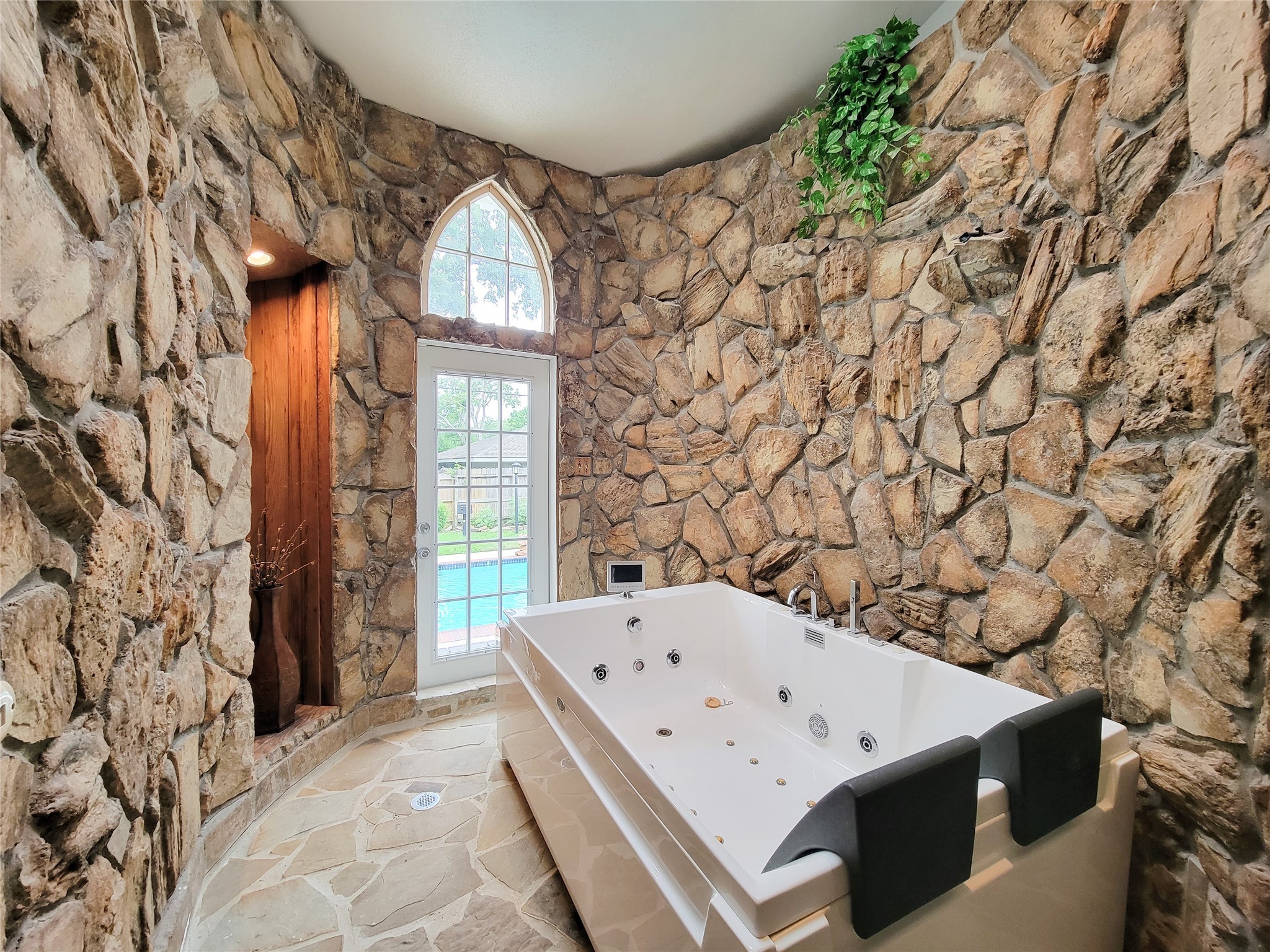 5654 Cheena Drive Houston, TX 77096 - Photo 3 of 50 a bath tub sitting in a bathroom next to a window
