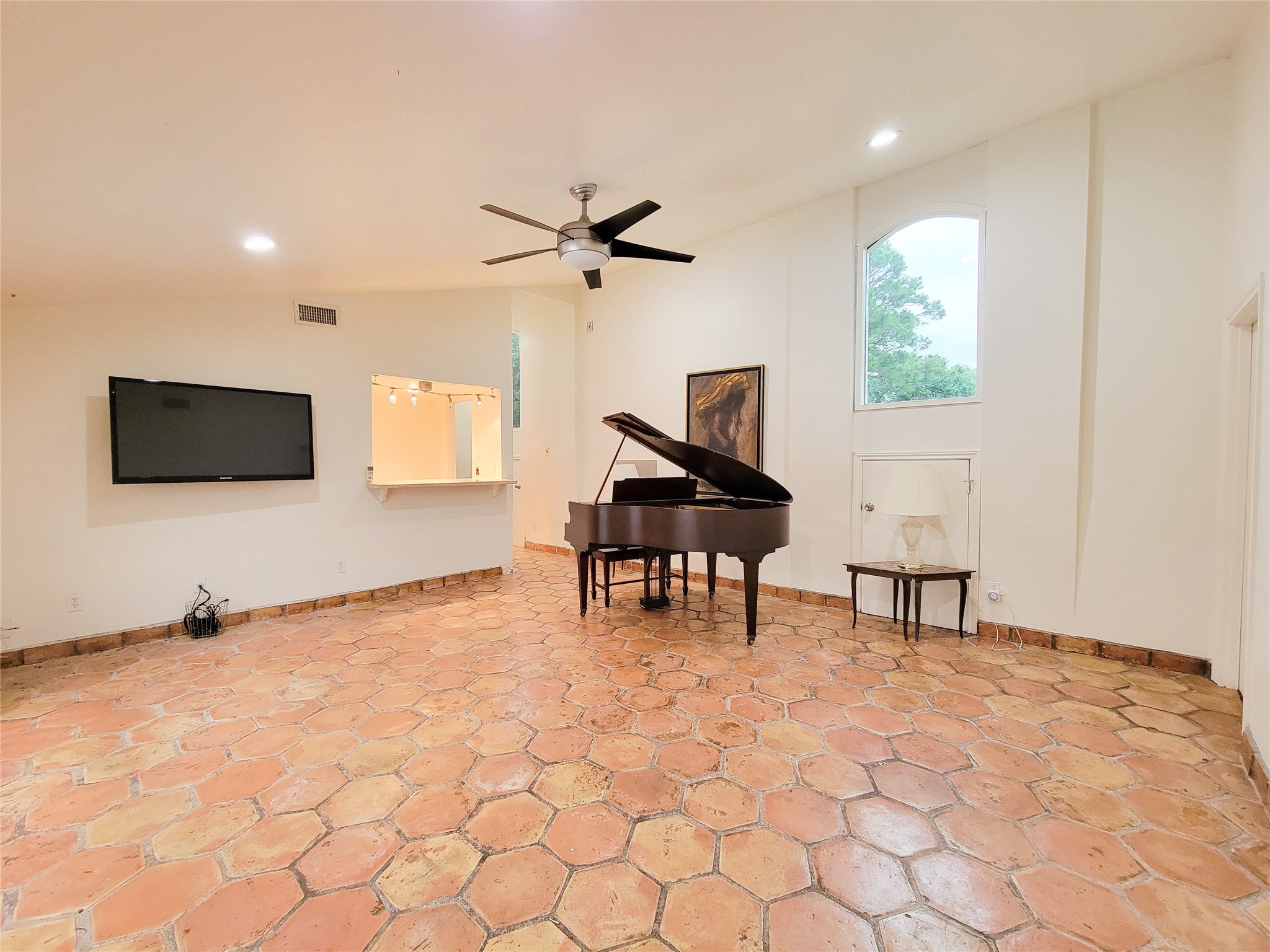 5654 Cheena Drive Houston, TX 77096 - Photo 30 of 50 a living room with furniture and a flat screen tv
