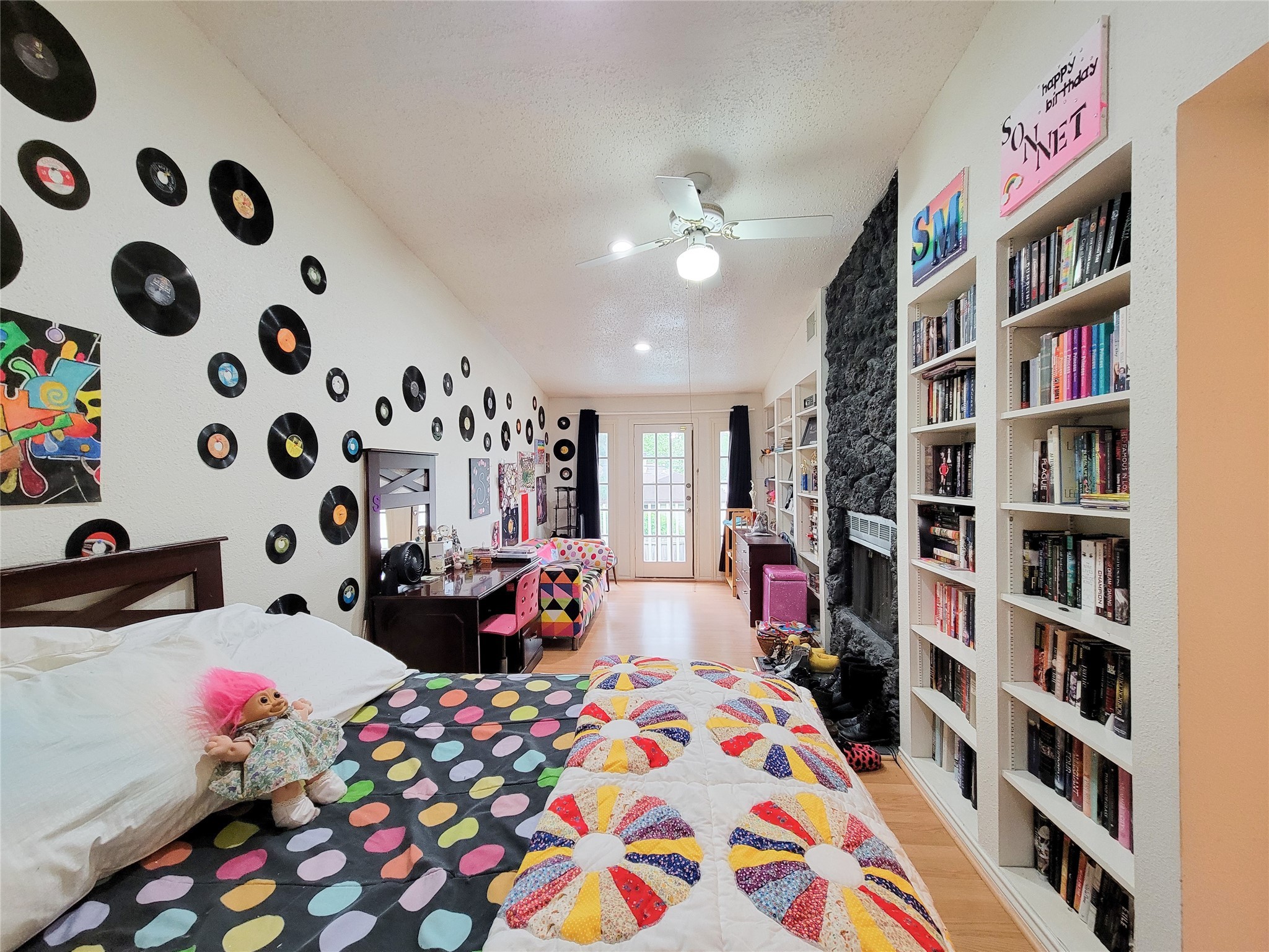 5654 Cheena Drive Houston, TX 77096 - Photo 32 of 50 a bed room with a bed and a book shelf