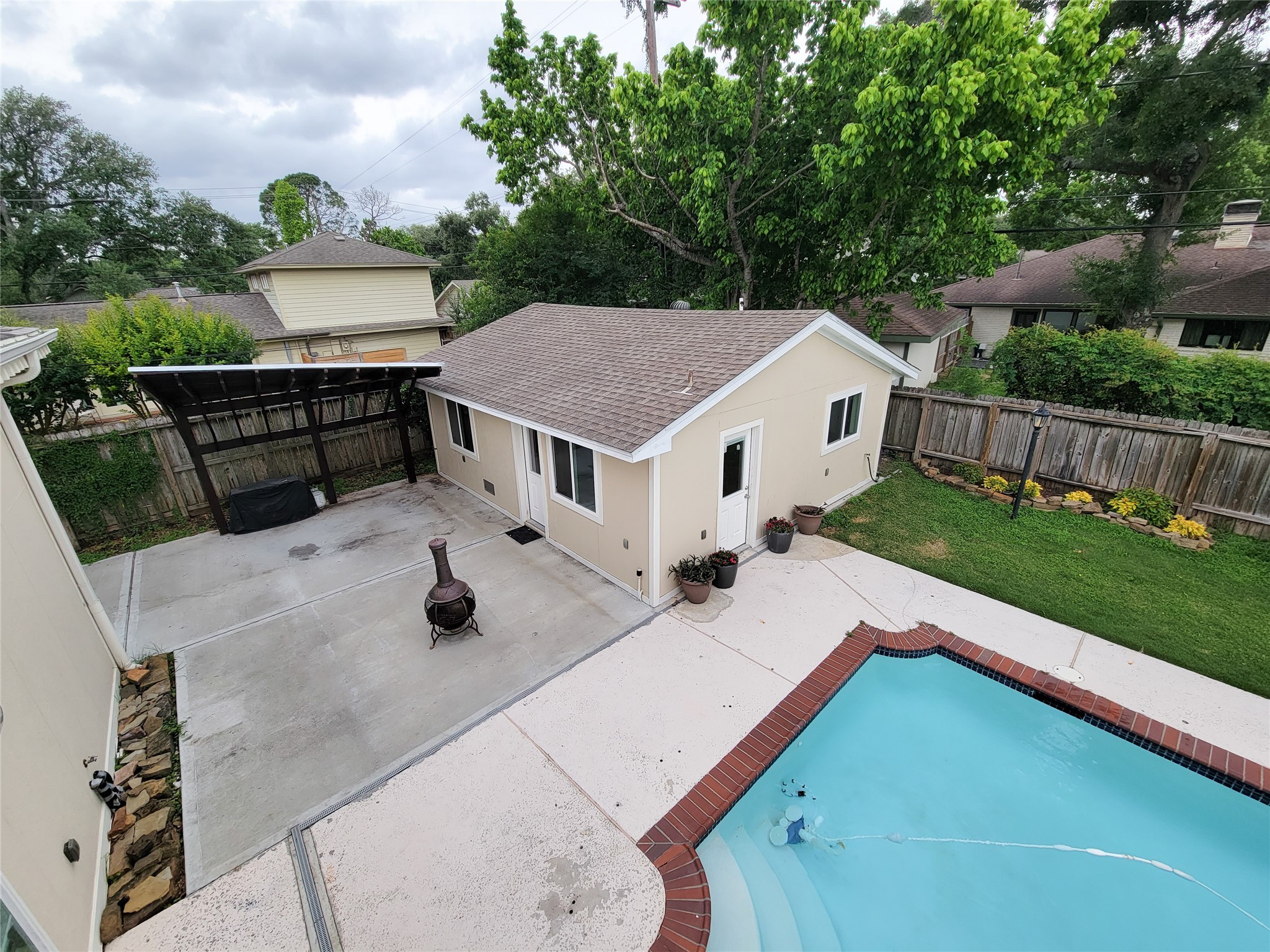 5654 Cheena Drive Houston, TX 77096 - Photo 36 of 50 a view of house with backyard outdoor seating and green space