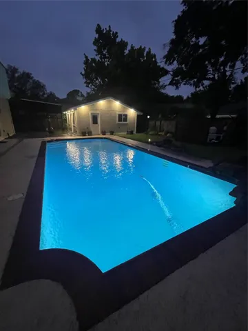 a view of swimming pool from a balcony