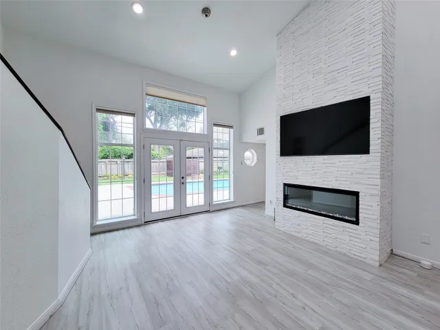 a view of livingroom with furniture flat screen tv and staircase