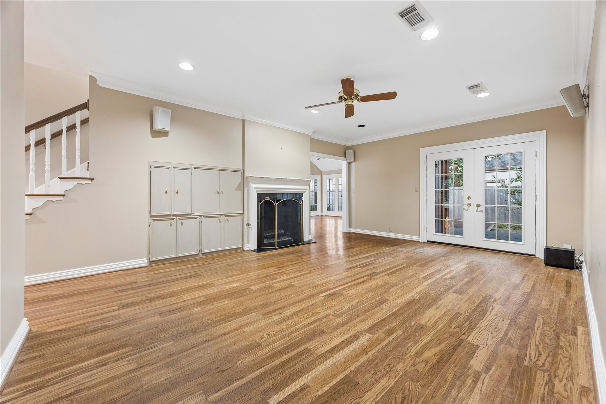 636 Rancho Bauer Drive Houston, TX 77079 - Photo 10 of 42 Living area with built-ins flanking the fireplace. The space and flow of the home provide so many options for you to entertain and enjoy. New doors to the outdoor patio.