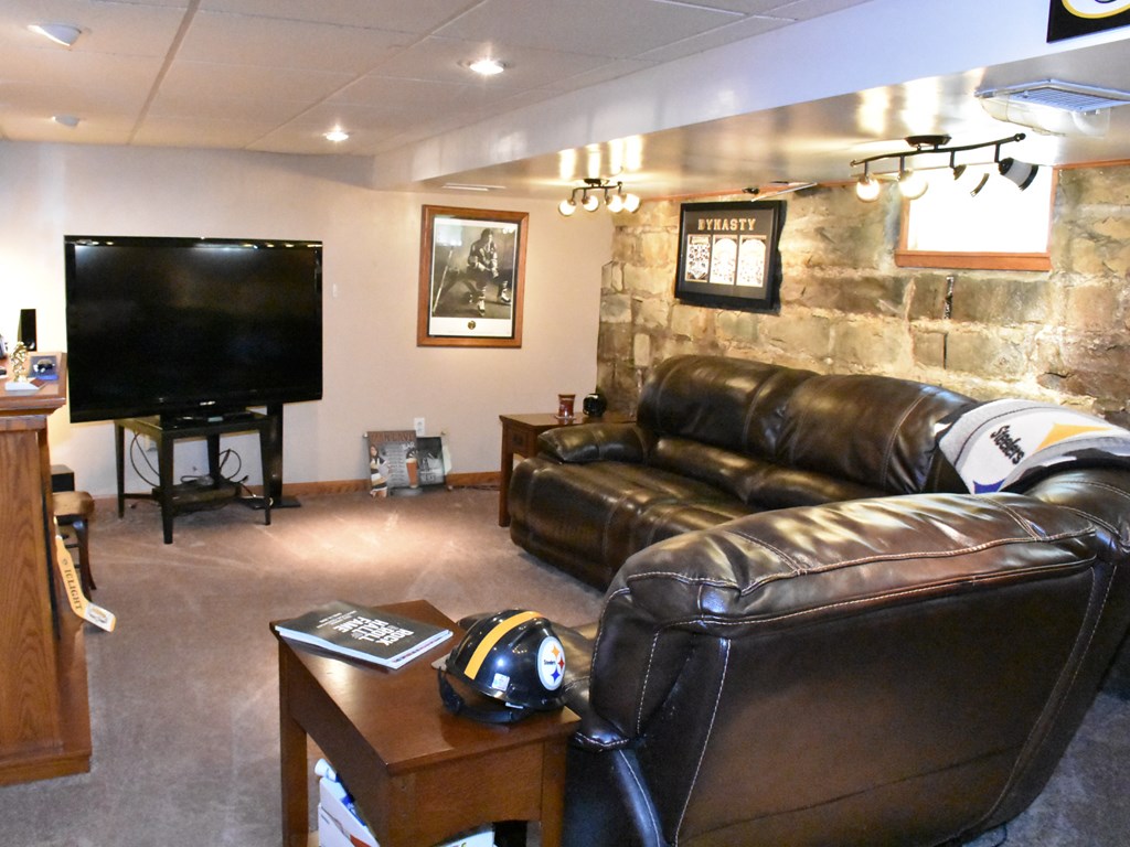 655 Chestnut Street Meadville, PA 16335 - Photo 18 of 43 a living room with furniture and a flat screen tv