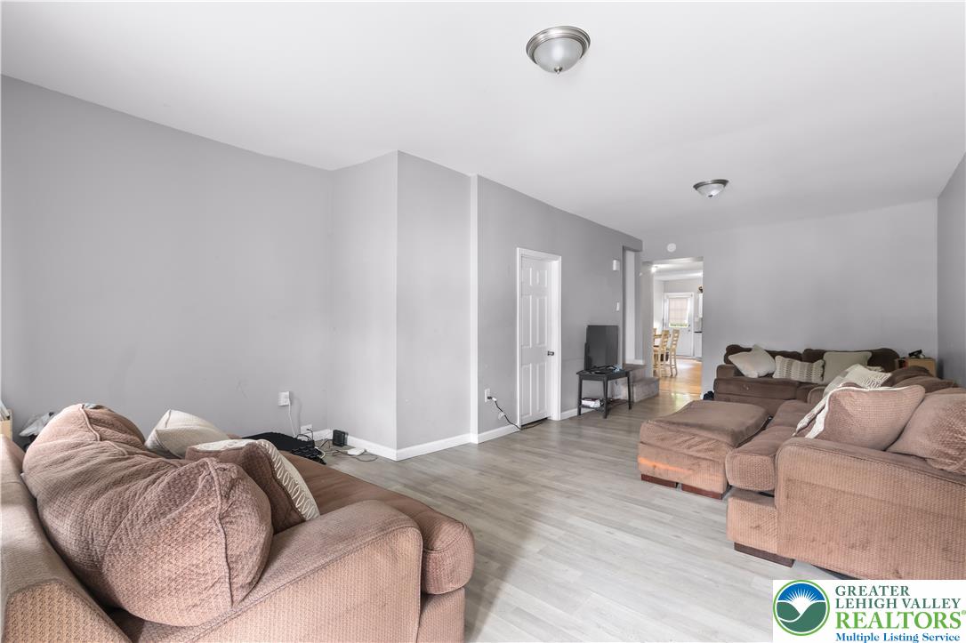12 South Front Street Coplay, PA 18037 - Photo 19 of 41 This welcoming living area features sleek flooring and a clear path to the dining space.
