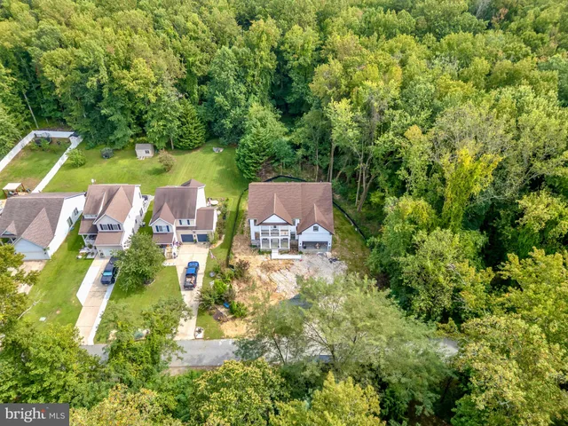 a view of a city with lush green forest