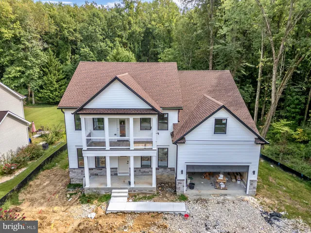 a aerial view of a house with yard and sitting area
