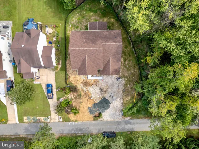 an aerial view of residential house with outdoor space and swimming pool