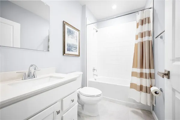 a bathroom with a sink a toilet and a bathtub