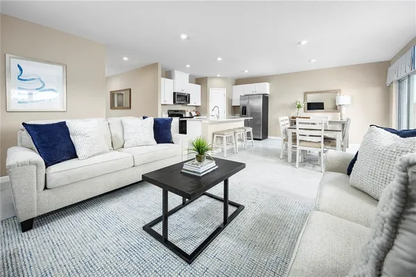 a living room with furniture or kitchen view and a fireplace