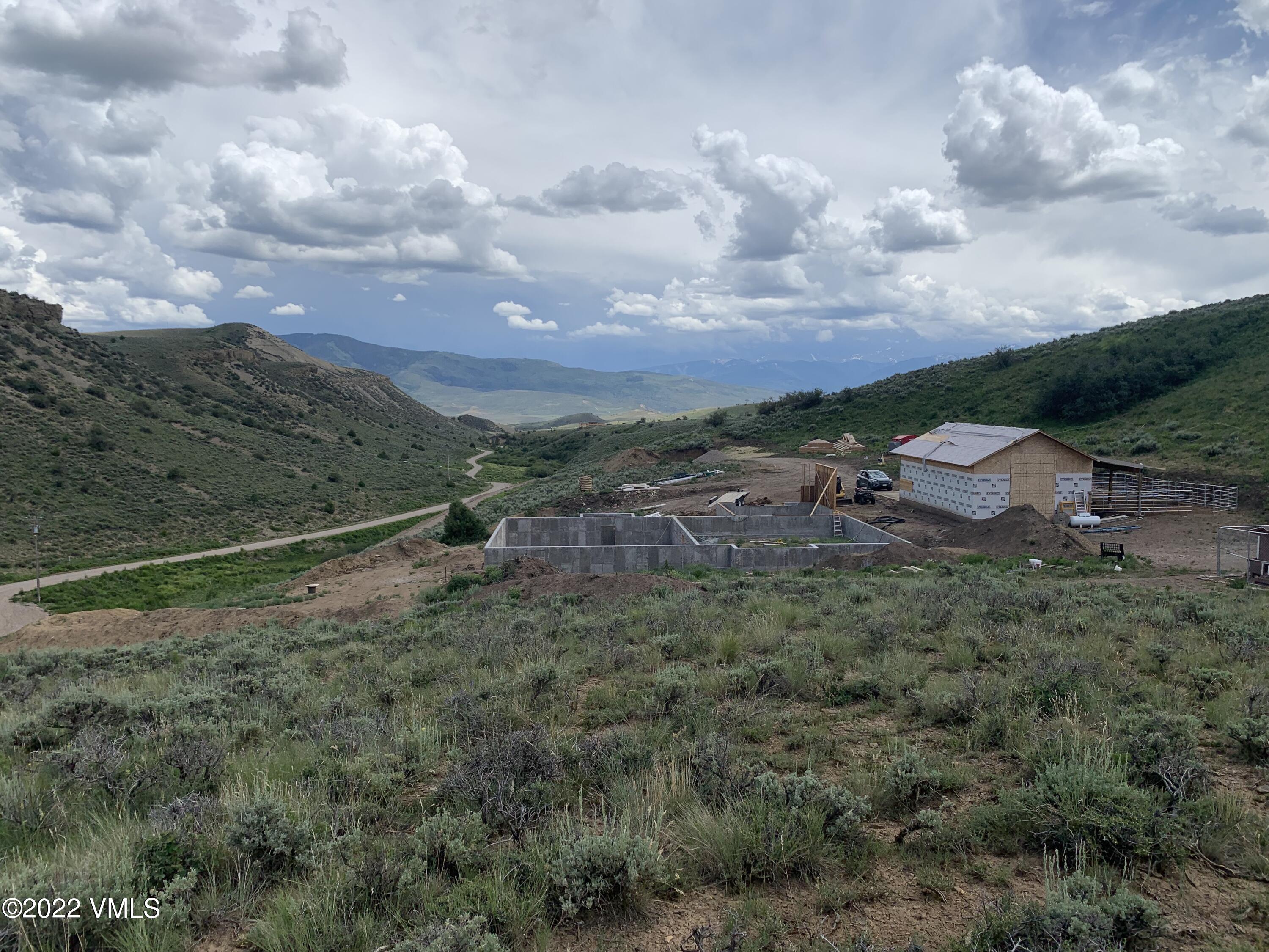 1397 Horse Mountain Ranch Road Wolcott, CO 81655 - Photo 1 of 5 a view of a dry yard with lots of trees