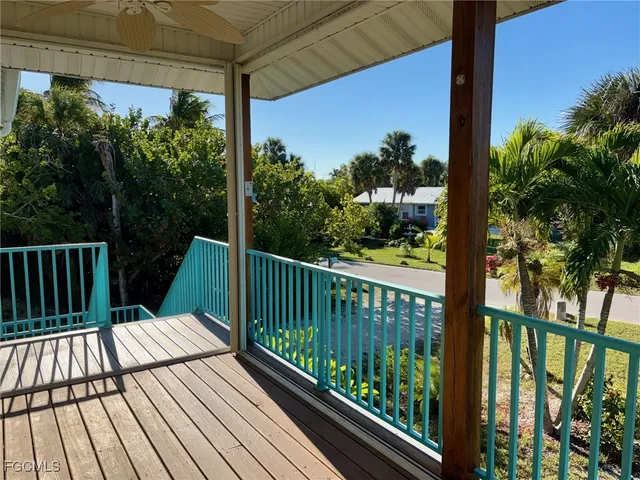 a view of a balcony with wooden floor