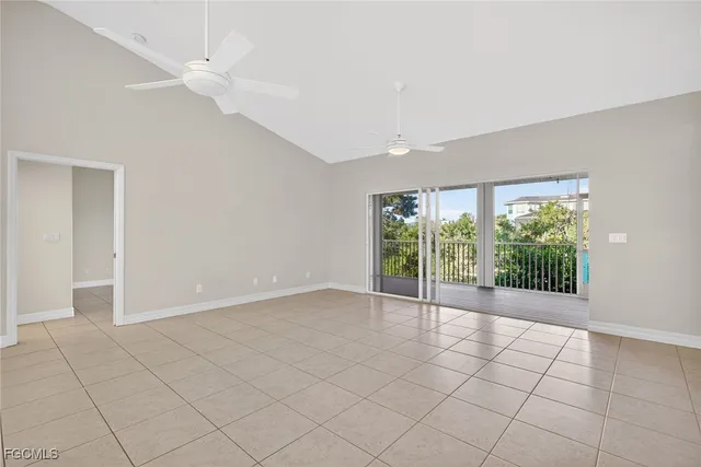 a large white kitchen with a large window cabinets and stainless steel appliances