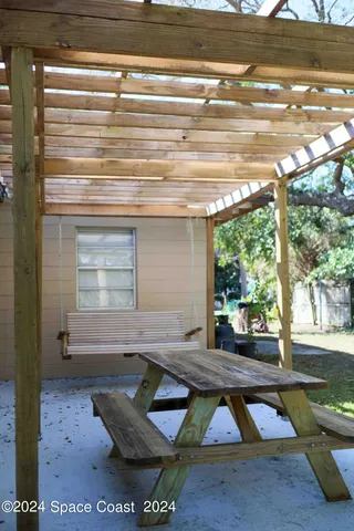 a view of kitchen with wooden floor and window