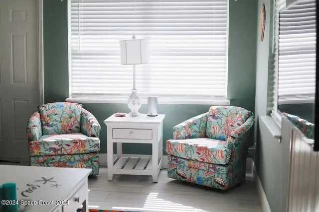 a living room with furniture and a table
