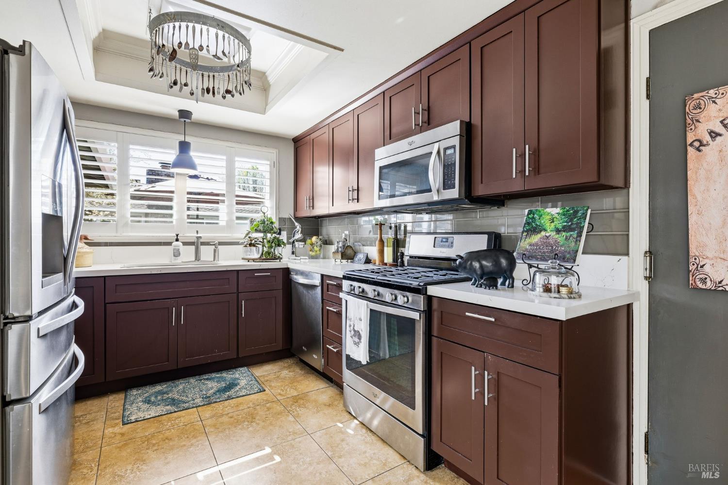 7409 Oakmont Drive Santa Rosa, CA 95409 - Photo 21 of 44 a kitchen with stainless steel appliances granite countertop a stove sink and cabinets