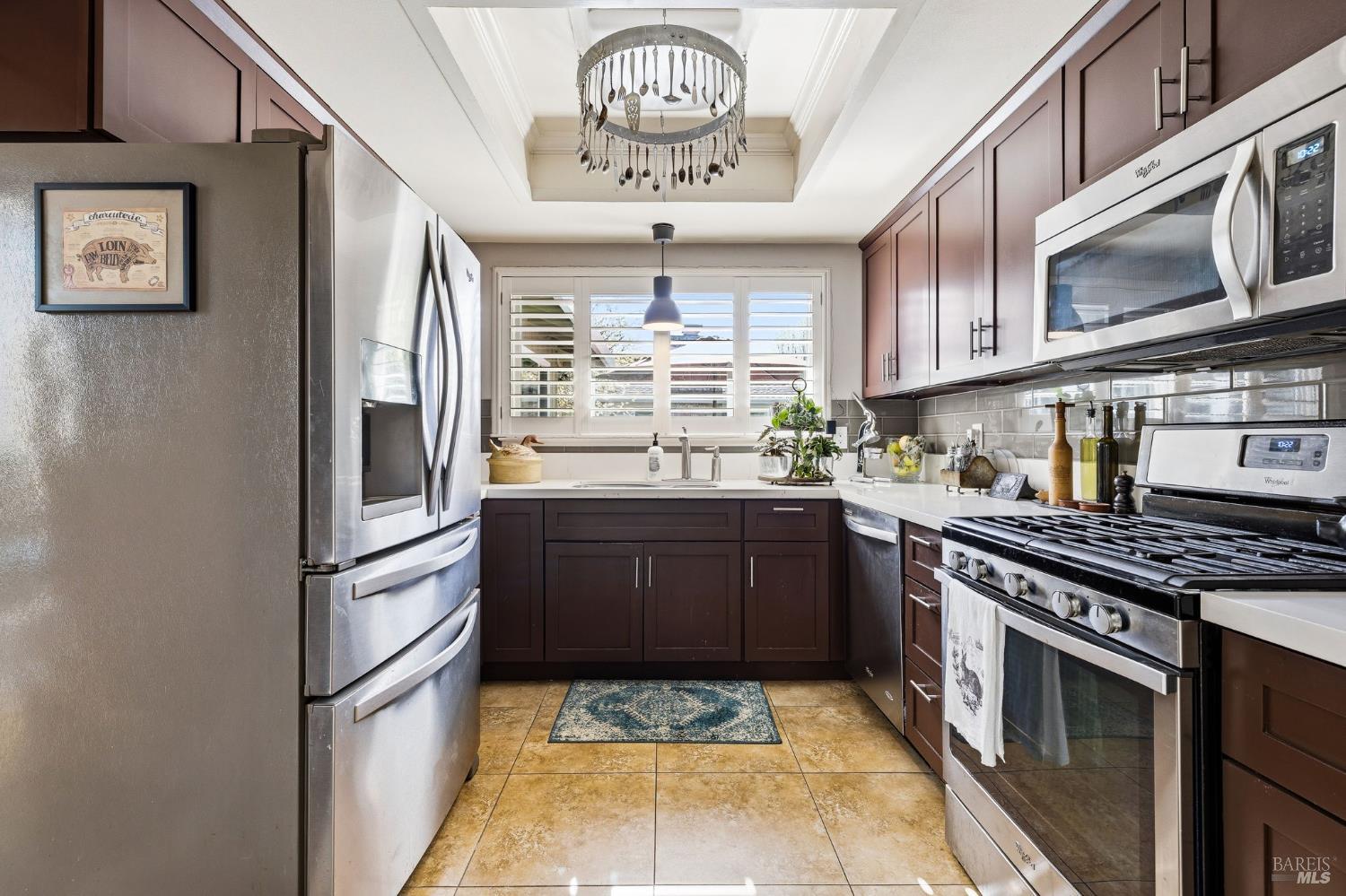 7409 Oakmont Drive Santa Rosa, CA 95409 - Photo 22 of 44 a kitchen with stainless steel appliances granite countertop a stove a refrigerator and a sink