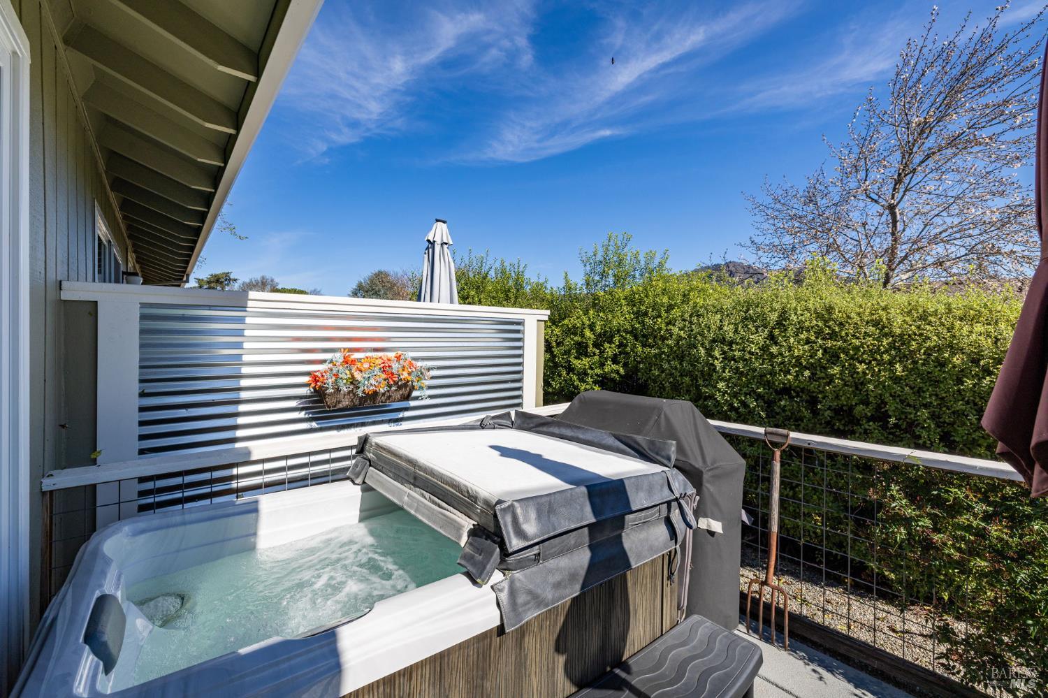 7409 Oakmont Drive Santa Rosa, CA 95409 - Photo 31 of 44 a view of a balcony with two chairs and a barbeque
