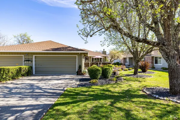 a front view of a house with swimming pool and porch