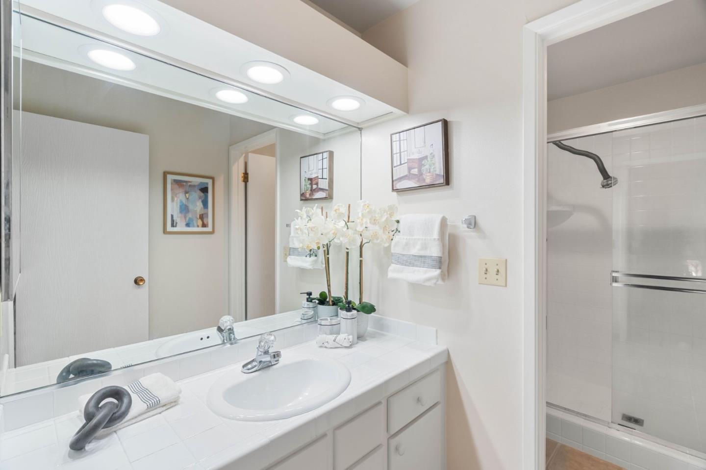 100 East Middlefield Road, Unit 6G Mountain View, CA 94043 - Photo 14 of 34 a bathroom with a sink and a mirror