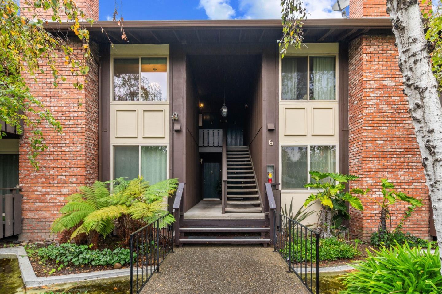 100 East Middlefield Road, Unit 6G Mountain View, CA 94043 - Photo 18 of 34 a front view of a house with a garden
