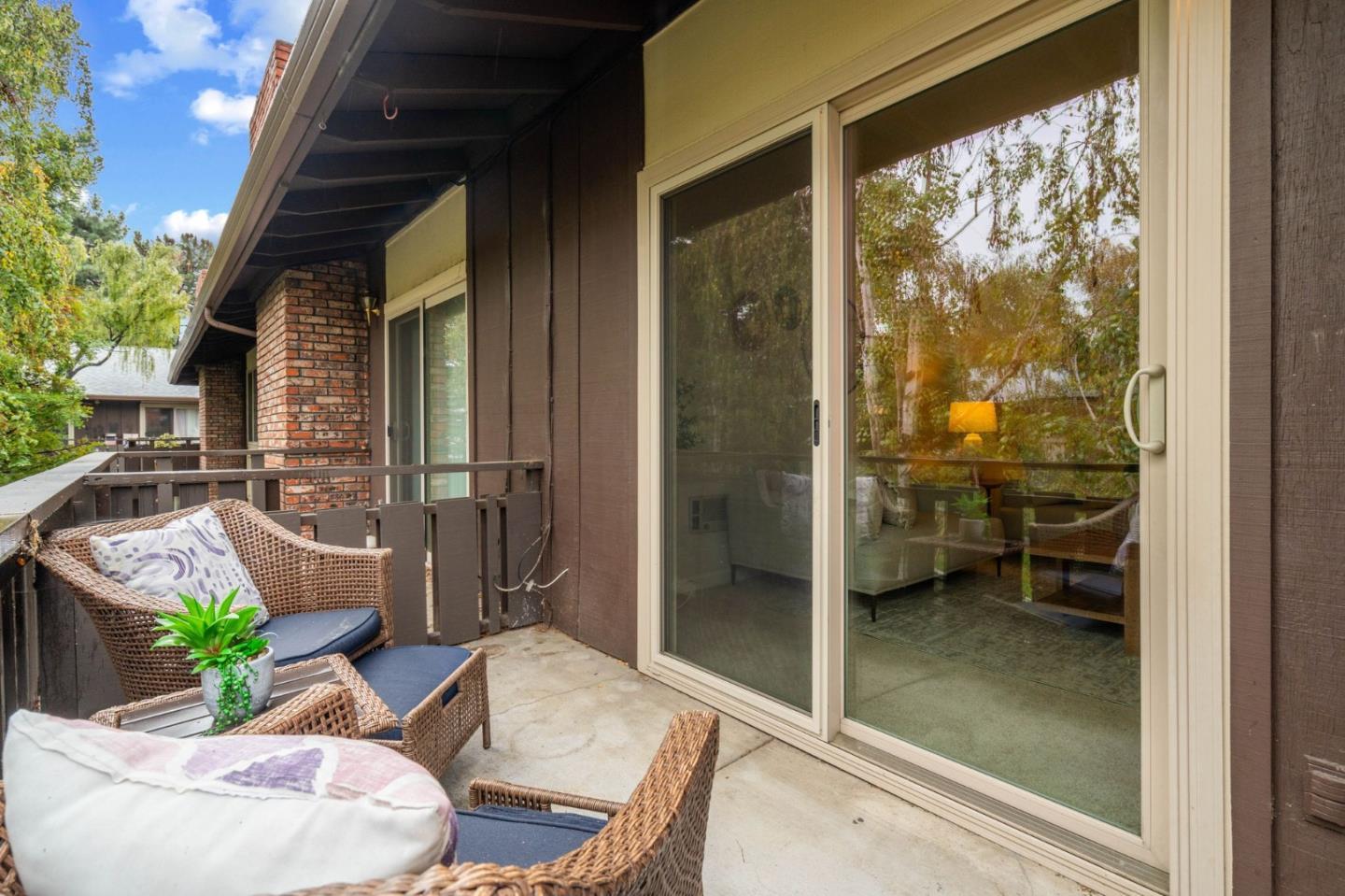100 East Middlefield Road, Unit 6G Mountain View, CA 94043 - Photo 20 of 34 a balcony with furniture and a potted plant