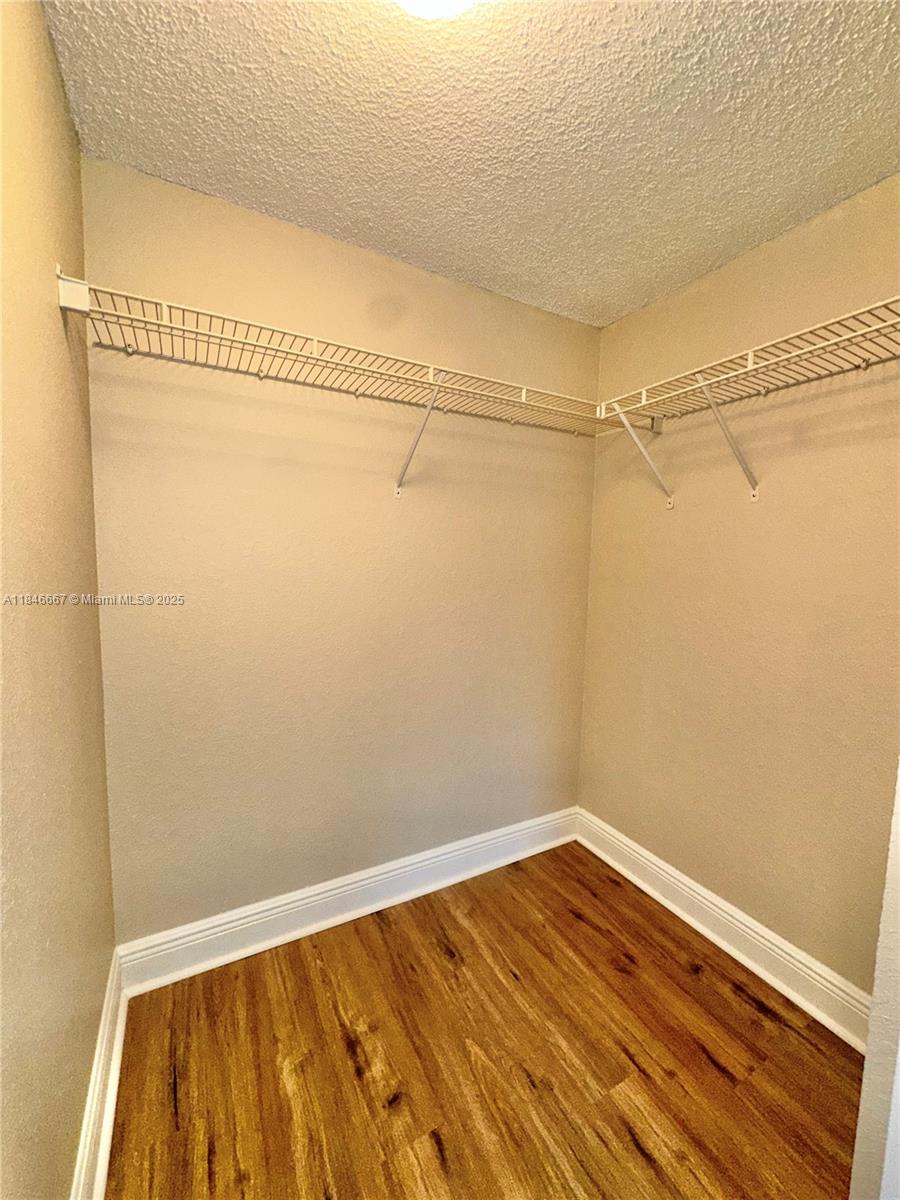 1620 Balfour Point Drive, Unit G West Palm Beach, FL 33411 - Photo 15 of 15 a view of a room with wooden floor
