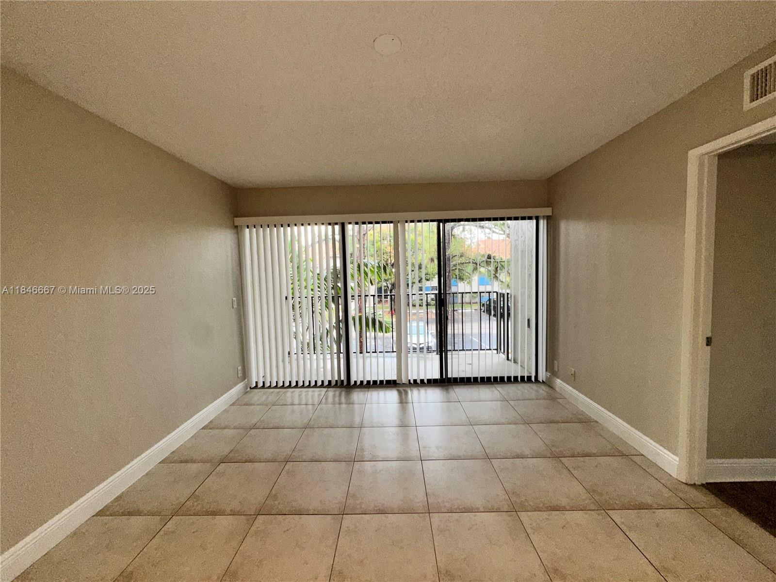 1620 Balfour Point Drive, Unit G West Palm Beach, FL 33411 - Photo 6 of 15 a view of a room with a large window