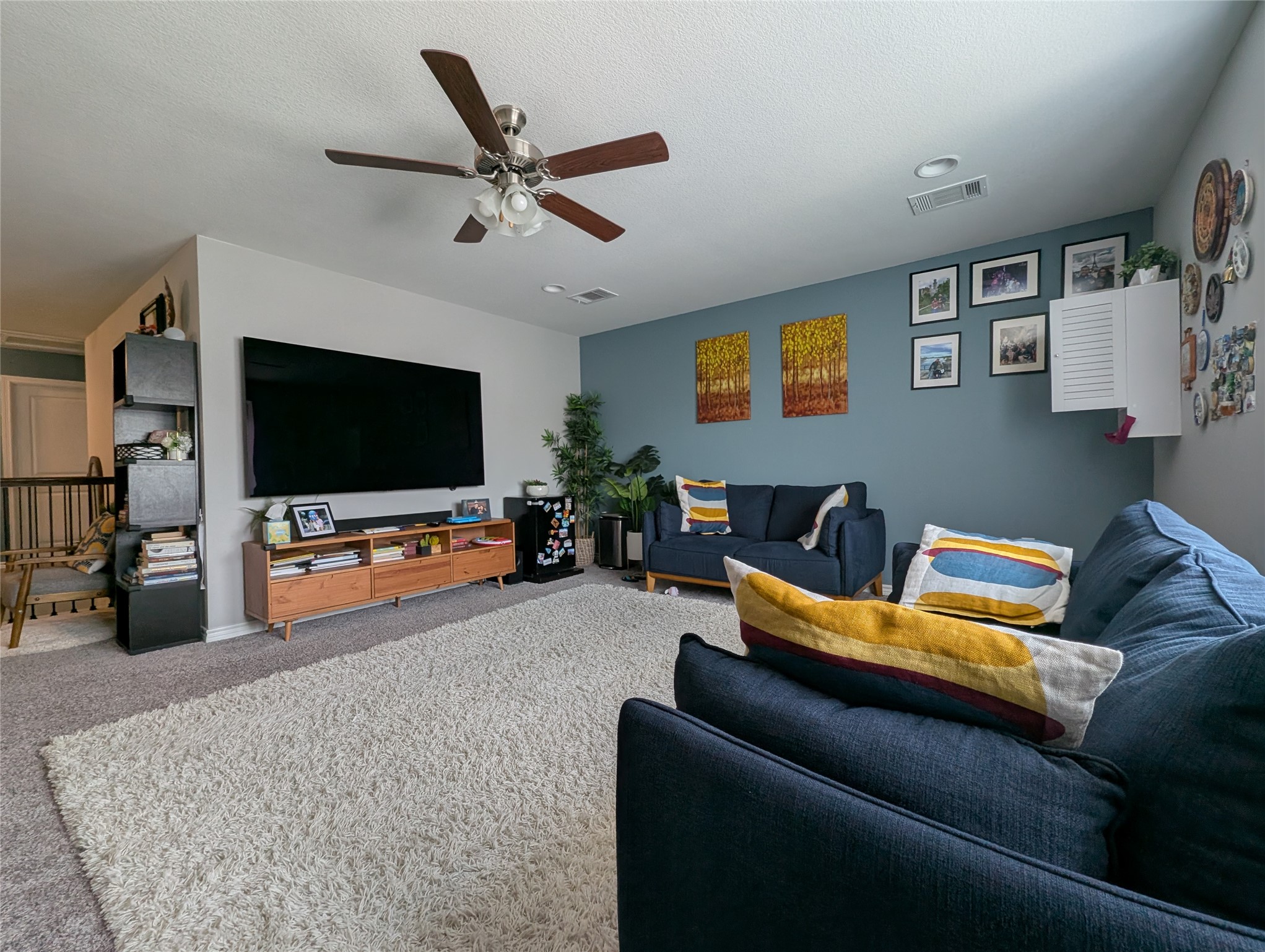 14502 McCoy Loop Austin, TX 78717 - Photo 5 of 26 Living area featuring a textured ceiling, a ceiling fan with integrated lighting, and recessed lighting