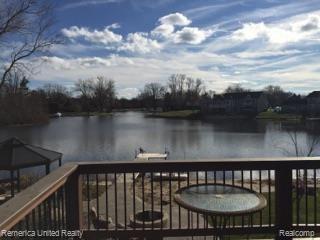 3467 East Commerce Road Commerce Township, MI 48382 - Photo 14 of 36 Deck from Hearth Room offering spectacular views of the lake.