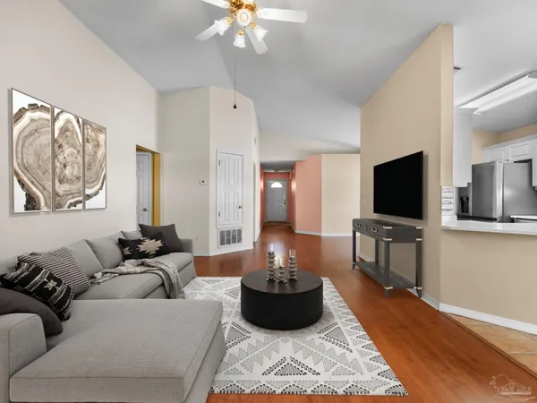 a living room with furniture and a flat screen tv